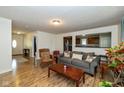 Bright living room featuring wood floors, neutral walls, and a view to the kitchen at 29 Northview Dr, Danville, IN 46122