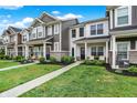 Attractive townhomes with a well-kept lawn and inviting walkways, creating a welcoming community feel at 3428 Thomas Jefferson St, Westfield, IN 46074
