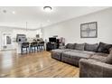 Open concept living space with modern finishes, seamlessly connecting the living room and kitchen at 3428 Thomas Jefferson St, Westfield, IN 46074