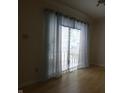 Bright living room with attractive curtains, blinds, and sliding glass doors at 4486 Abby Creek Ln, Indianapolis, IN 46205