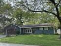 Well-maintained home with an American flag, lush green lawn, and inviting curb appeal at 526 Emerson Rd, Carmel, IN 46032
