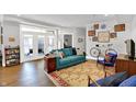 Bright living room boasts natural light, hardwood floors, stylish décor and a walkout patio at 622 E 10Th St # 310, Indianapolis, IN 46202