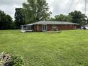 Large backyard features a screened in porch and mature shade trees at 6237 E Lynn Dr, Mooresville, IN 46158
