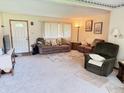 Living room showcasing neutral carpet, ample seating and natural light at 6237 E Lynn Dr, Mooresville, IN 46158