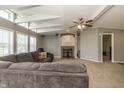 Bright living room with a large sofa, decorative fireplace, and unique vaulted ceiling at 1114 E 234Th St, Sheridan, IN 46069