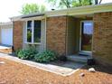 Inviting brick home with a bay window and a glass front door at 11343 E 191St St, Noblesville, IN 46060