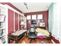 Functional bedroom with a desk, storage, and natural light from three windows with a view at 1217 Old Vines Trl, Greenwood, IN 46143