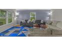 Bright living room featuring stylish sofas, and a modern blue and grey rug at 1535 Whalen Ave, Indianapolis, IN 46227
