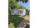 Single-story home with new landscaping at 1584 Shady Ln, Columbus, IN 47201