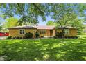 Traditional brick home featuring large front yard with mature trees at 1914 S Avon Ave, Avon, IN 46123
