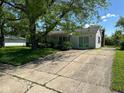 Charming ranch-style home with an elongated front porch and a long driveway at 3155 Roseway Dr, Indianapolis, IN 46226