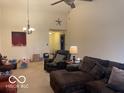 Open living room with neutral walls, ceiling fan, and cozy seating area at 3861 Indigo Blue Blvd, Whitestown, IN 46075