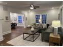 Inviting living room with hardwood floors, neutral paint, stylish furniture, and ample natural light at 4619 N Park Ave, Indianapolis, IN 46205