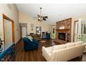 Bright living room with fireplace, vaulted ceiling, hardwood floors and outdoor views at 4901 E County Road 100 N, Avon, IN 46123