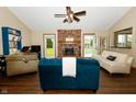 Inviting living room featuring a brick fireplace, vaulted ceilings and an open floor plan at 4901 E County Road 100 N, Avon, IN 46123
