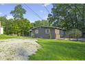 Charming home with gray siding, decorative shutters, and a well-maintained front yard at 5570 Paradise Ct, Martinsville, IN 46151