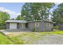 Charming home with gray siding, decorative shutters, and a well-maintained front yard at 5570 Paradise Ct, Martinsville, IN 46151