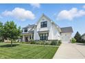 Stunning two-story home with a three-car garage and well-manicured landscaping at 6882 Bladstone Rd, Noblesville, IN 46062