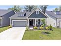 Charming single-Gathering home featuring a gray color scheme, well-manicured lawn, and attached garage at 7154 Covington St, Lebanon, IN 46052