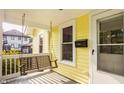 Cozy front porch featuring a swing and clear view of the house number on a sunny day at 743 Sanders St, Indianapolis, IN 46203
