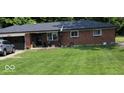 Charming single-story brick home with a well-maintained lawn and attached garage at 8990 N 850 W, Fairland, IN 46126