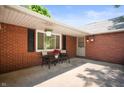 Enclosed patio space with brick walls, offering a cozy seating area perfect for relaxation and outdoor enjoyment at 106 N Jamalee Way, Pendleton, IN 46064