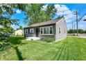 Well-kept house with grey siding, white trim, and a green front lawn at 11 14Th St, Franklin, IN 46131