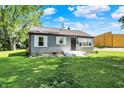 Quaint one-story house featuring a lush lawn and minimalist landscaping at 11 14Th St, Franklin, IN 46131