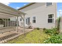 Private backyard with brick patio, pergola, swing, and lush greenery at 11105 Deer Valley Dr, Indianapolis, IN 46229