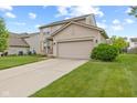 Two-story home with attached two car garage, well-maintained lawn, and classic siding at 11105 Deer Valley Dr, Indianapolis, IN 46229