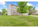 Inviting two-story home with brick accents, well-kept lawn, and mature landscaping at 11105 Deer Valley Dr, Indianapolis, IN 46229