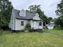 Inviting single-Gathering home with a lush green lawn and side yard at 114 S Green St, Brownsburg, IN 46112