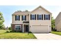 Charming two-story home with a well-manicured lawn and a two-car attached garage at 12343 Slate Dr, Fishers, IN 46037