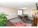 Bright game room featuring a billiard table, dark floors, and natural lighting at 12343 Slate Dr, Fishers, IN 46037