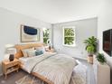 Relaxing bedroom features soft carpet, a wooden bed frame, nightstands, and bright windows for a serene retreat at 1525 Bluestem Dr, Greenwood, IN 46143