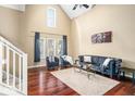 Bright living room features hardwood floors, high ceilings, and plenty of natural light at 2230 N Pennsylvania N St # 7, Indianapolis, IN 46205