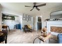 Bright living room featuring modern decor, a fireplace, and open access to the kitchen at 250 N 18Th Ave, Beech Grove, IN 46107