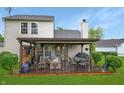 Inviting covered patio with comfortable seating, a dining area, and string lights, creating a relaxing outdoor space at 4442 Victory Cir, Indianapolis, IN 46203