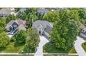 Aerial shot showcasing the house surrounded by lush greenery in a peaceful, upscale neighborhood at 4763 Woods Edge Dr, Zionsville, IN 46077
