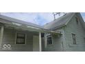 Side view of a charming home highlighting the windows and door, capturing the essence of a quiet, comfortable space at 479 W Pike St, Martinsville, IN 46151
