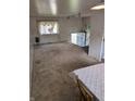 Open living room with carpet and a staircase leading to the upper level at 5807 Sunwood Dr, Indianapolis, IN 46224