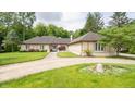 Beautiful front exterior view of this home, featuring a lush lawn and unique architectural design at 7554 Silverpine Ct, Indianapolis, IN 46250