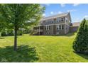 Expansive backyard with lush green lawn, perfect for outdoor activities and relaxation at 15047 Glenmoor Cir, Carmel, IN 46033