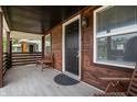 Inviting covered porch with wood accents and seating area at 1529 E Tabor St, Indianapolis, IN 46203