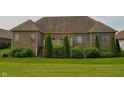 Spacious backyard with mature trees and lush green grass that backs up to the home at 16550 Gleneagles Ct, Noblesville, IN 46060