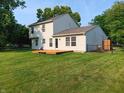 Spacious backyard featuring a wooden deck and lush green lawn at 18851 Wimbley Way, Noblesville, IN 46060