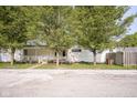 Charming home features a quaint porch, trees, and a serene setting for relaxation and curb appeal at 307 E 5Th St, Sheridan, IN 46069