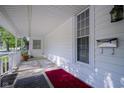 View of the home's porch that features durable rugs, ample space, and protective railings at 307 E 5Th St, Sheridan, IN 46069