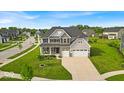 Wide aerial view of the property, showcasing lush lawn, tidy landscaping, and surrounding neighborhood at 4416 Eaglecrest Pl, Zionsville, IN 46077