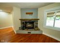 A stone fireplace in the living room creates a cozy and inviting space at 5116 W County Road 450 S, Coatesville, IN 46121
